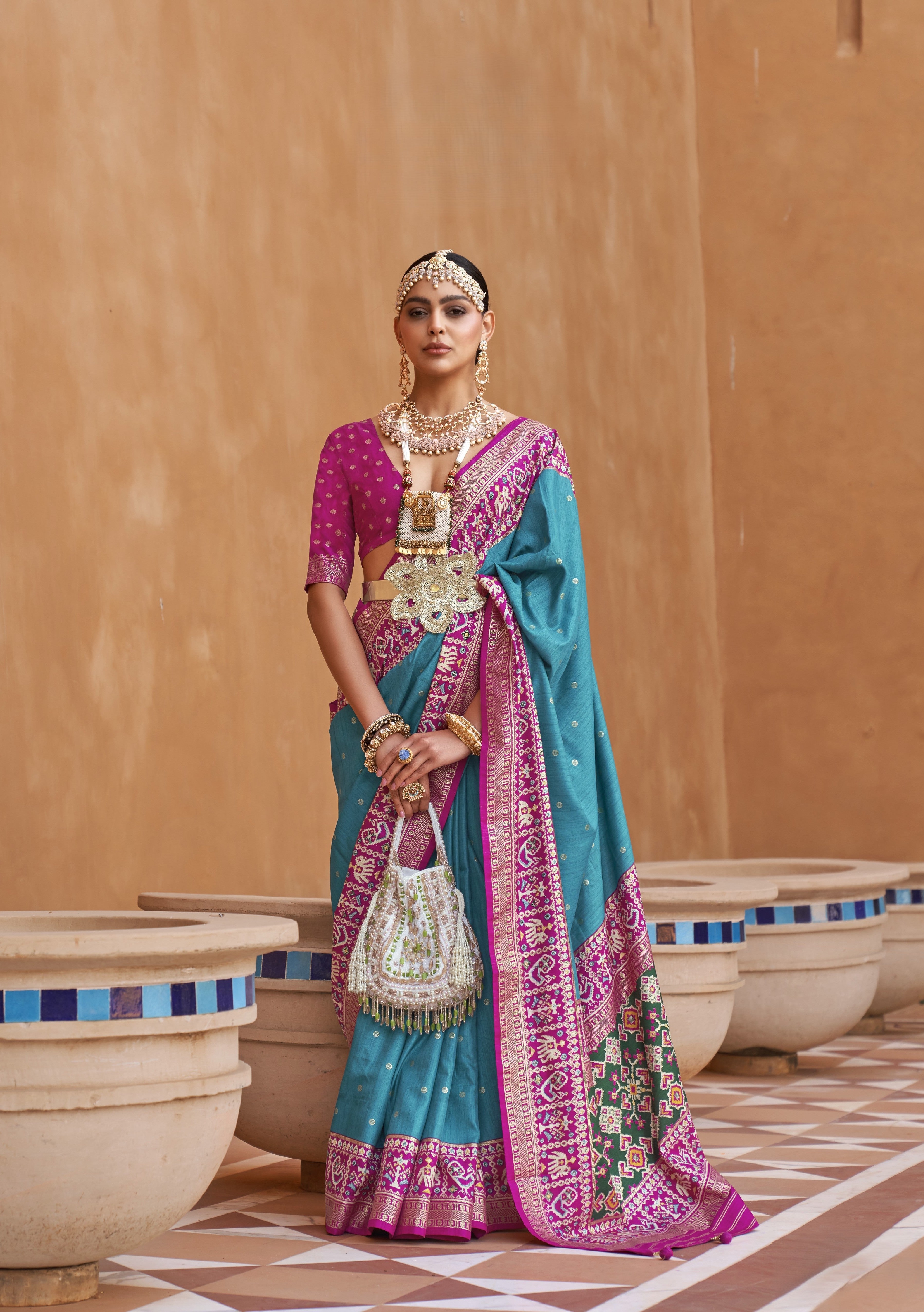 Turquoise Blue Silk Saree With Patola Border